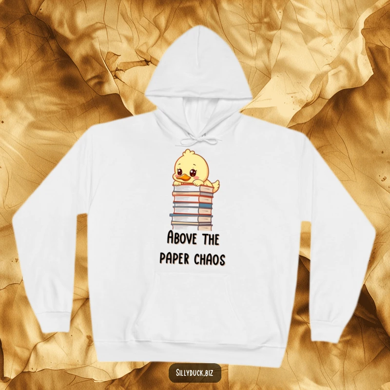 Funny Hoodie displays a kawaii duck peering over a tall desk pile with a focused, determined look, perfect for study sessions.